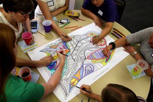 Hands of Group Coloring a Coloring Poster