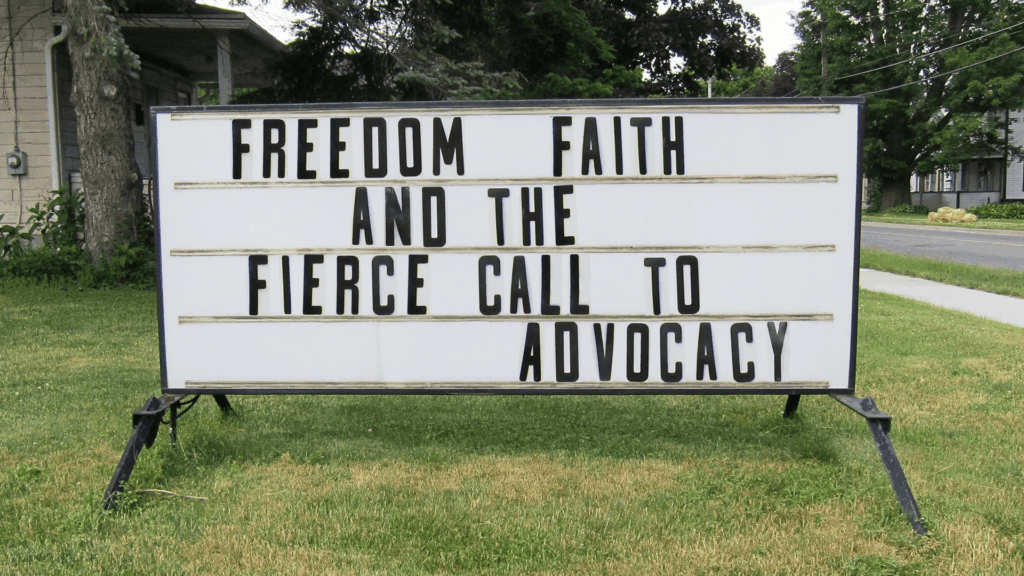 Church marquee sign with message about freedom, faith, and the fierce call to advocacy, emphasizing justice-centered Christian discipleship.