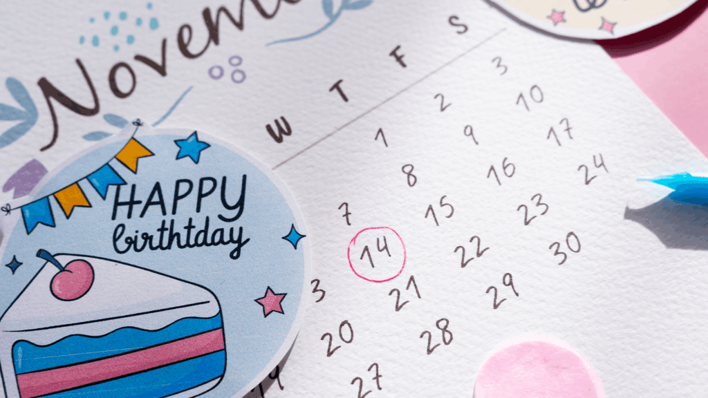 Close-up of a November calendar page with a “Happy Birthday” sticker and a circled date. A reminder of including birthdays and milestones in youth ministry planning.