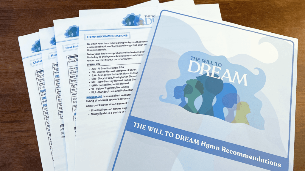 Printed pages of The Will to Dream: Hymn Recommendations resource from Illustrated Ministry, featuring a list of Advent, Christmas, and Epiphany hymns spread out on a wooden table.