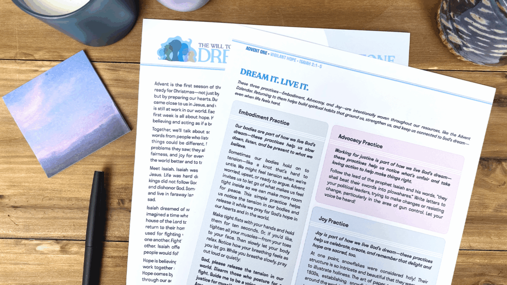 Close-up photo of Illustrated Ministry’s Advent resource pages from “The Will to Dream,” showing spiritual practices for embodiment, advocacy, and joy on a wooden desk with a pen, sticky note, and candle.