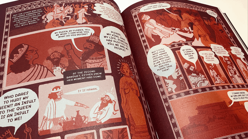 Open spread from The Book of Belonging retelling the story of Esther in a graphic-novel style. The pages use warm red and orange tones with speech bubbles and illustrated characters across multiple panels.