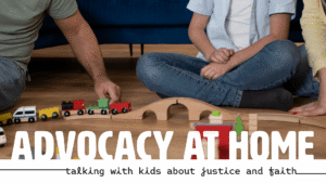 An adult and two children sit on the floor playing with a wooden toy train set. The words "Advocacy at Home: Talking With Kids About Justice and Faith" are at the bottom.