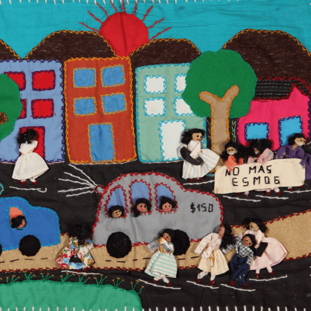 Colorful Chilean arpillera textile titled depicting environmental concerns using layered fabric and stitched figures.
