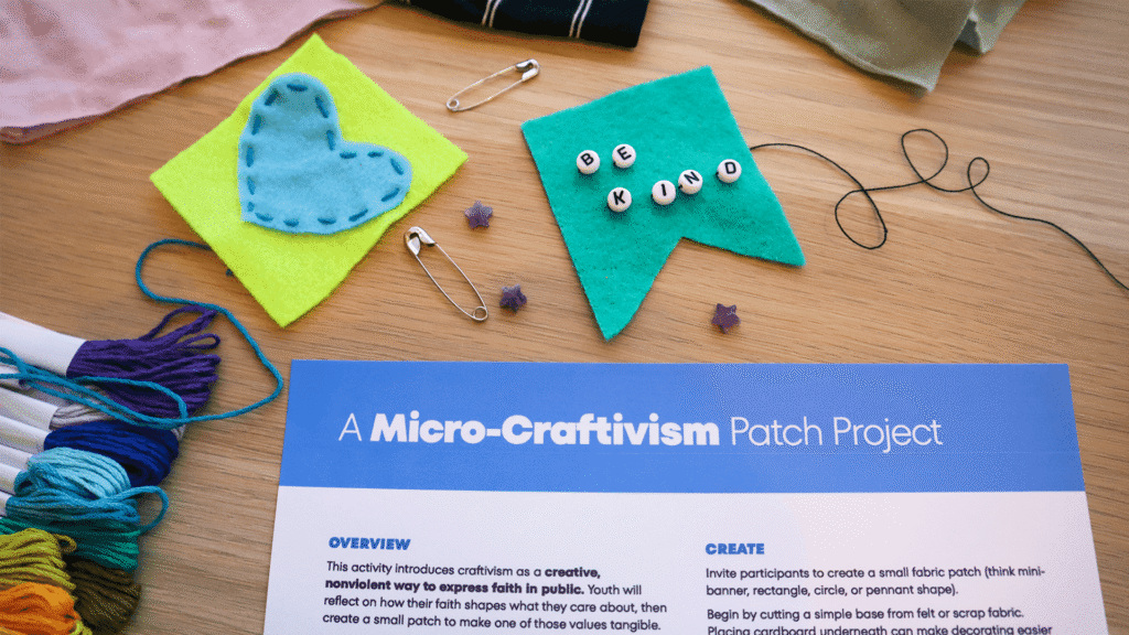 Printed guide titled “A Micro-Craftivism Patch Project” surrounded by felt patch examples, embroidery thread, safety pins, and craft supplies on a table.