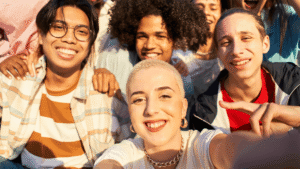 Diverse group of young people taking a selfie together, representing belonging, inclusion, and community in youth ministry.